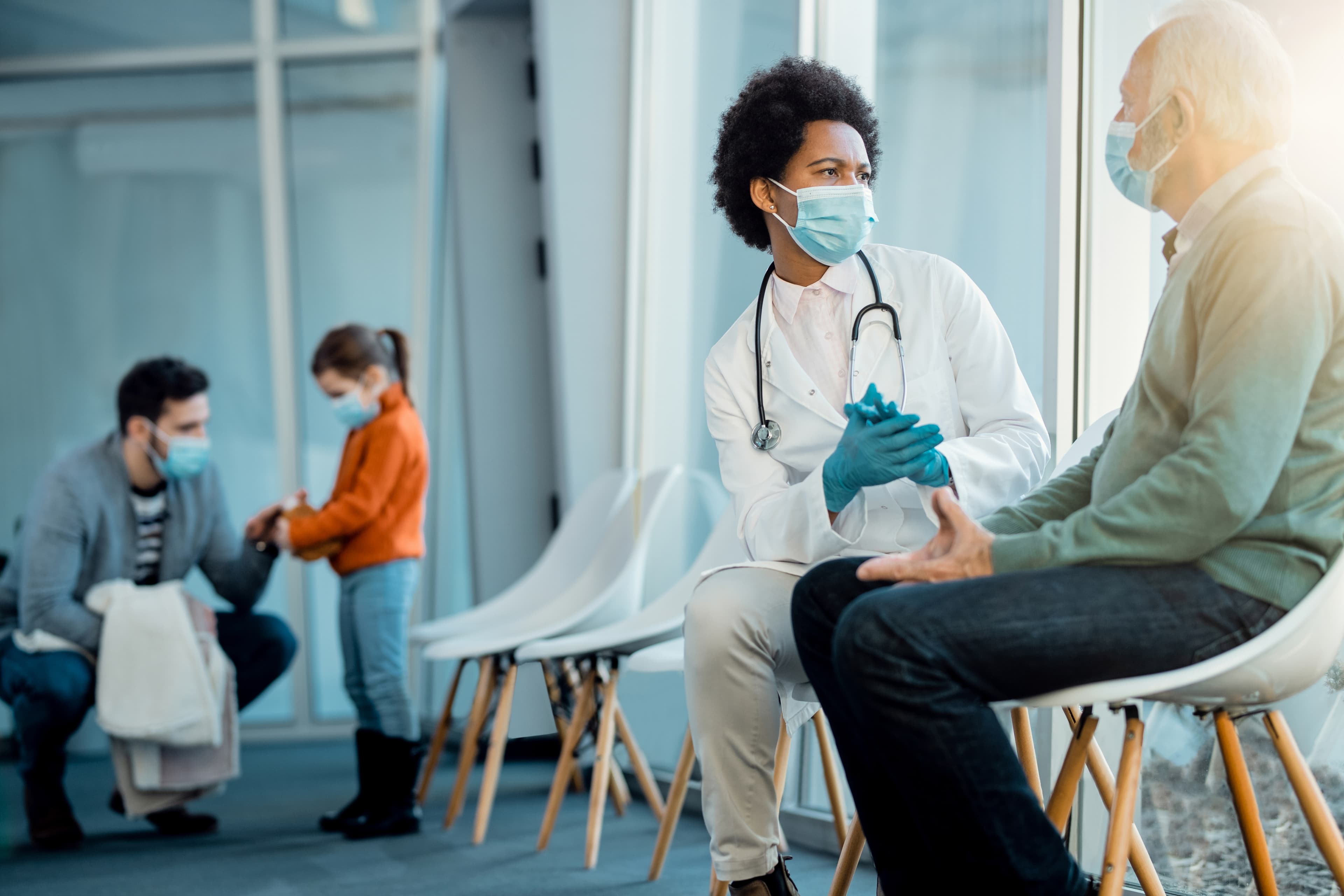 Healthcare workers providing medical care in a community setting